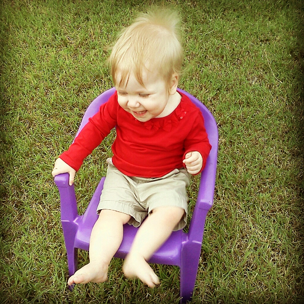 I think she loves the little chair.